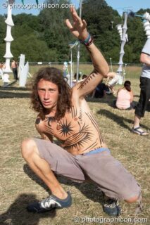 Man showing off his painted body at Glade Festival 2006. Aldermaston, United Kingdom. © 2006 Photographicon