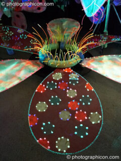 Brightly coloured model flowers in the Ultra Violet garden (part of the Soma chillout area) at Glade Festival 2006. Aldermaston, United Kingdom. © 2006 Photographicon