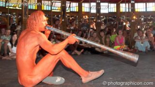 Naked Jovis plays a didgeridoo in the nude in the Pussy Parlure at Glade Festival 2006. Aldermaston, United Kingdom. © 2006 Photographicon