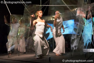 Dom Spiral, Irena Spiral, Tom Peto and Mira WeMoonSpiral of Arcescape perform a dance of light on the IDSpiral outdoor stage at Glade Festival 2006. Aldermaston, United Kingdom. © 2006 Photographicon