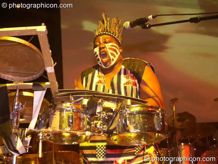 A tribally painted African drummer performs with Juno Reactor on the Glade Stage at Glade Festival 2006. Aldermaston, United Kingdom. © 2006 Photographicon