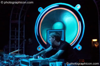 Richie Hawtin performs with his head profiled by a giant painted speaker backdrop on the Vapor Stage at Glade Festival 2007. Aldermaston, United Kingdom. © 2007 Photographicon