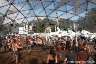 People dancing inside the IDspiral dome at Glade Festival 2007. Aldermaston, United Kingdom. © 2007 Photographicon