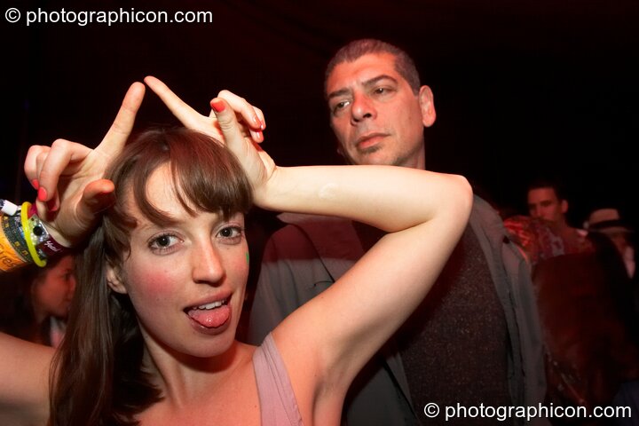 A wonky woman dances in the secret space Down The Rabbit Hole at Glade Festival 2011. King's Lynn, United Kingdom. © 2011 Photographicon