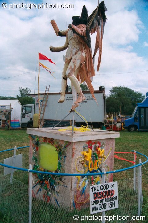 A statue of The God of Discard at Glastonbury Festival 2002. Pilton, United Kingdom. © 2002 Photographicon