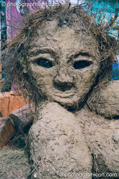A clay and straw sculpture of a pregnant woman that is also a bread oven at Glastonbury Festival 2002. Pilton, United Kingdom. © 2002 Photographicon