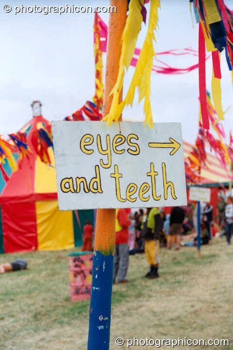 Eyes and teeth sign at Glastonbury Festival 2002. Pilton, United Kingdom. © 2002 Photographicon