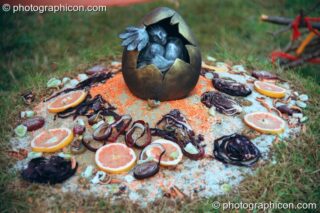 The egg shrine of a giant pheonix sculpture at Glastonbury Festival 2002. Pilton, United Kingdom. © 2002 Photographicon