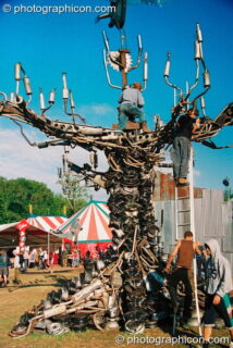 A tree sculpture made from car exhaust pipes in the Lost Vagueness field at Glastonbury Festival 2003. Pilton, United Kingdom. © 2003 Photographicon