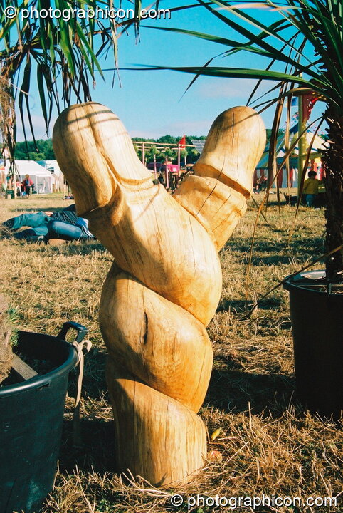 Vandweller wood sculpture of two entwined lingums at Glastonbury Festival 2003. Pilton, United Kingdom. © 2003 Photographicon