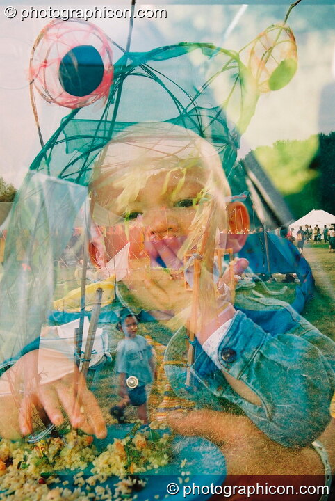 An accidental double-exposure of a child at Glastonbury Festival 2003. Pilton, United Kingdom. © 2003 Photographicon