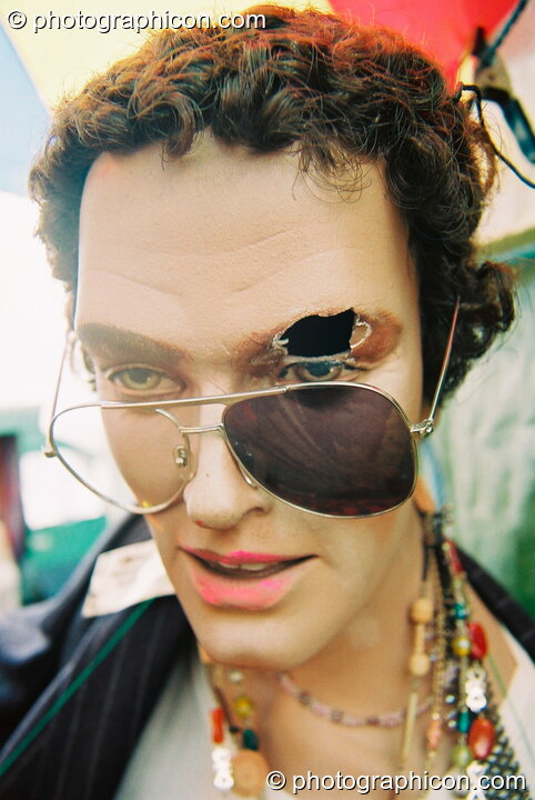 Male mannequin wearing sunglasses at Glastonbury Festival 2003. Pilton, United Kingdom. © 2003 Photographicon
