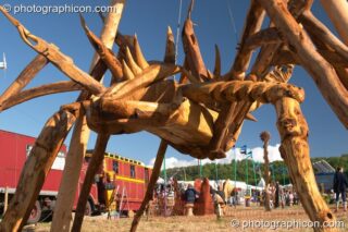 The Tree Pirates 25 foot scorpion chainsaw sculpture at Glastonbury Festival 2004. Pilton, United Kingdom. © 2004 Photographicon