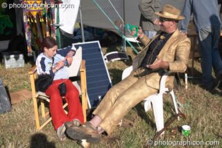 Man spray-painted gold suit at Glastonbury Festival 2004. Pilton, United Kingdom. © 2004 Photographicon