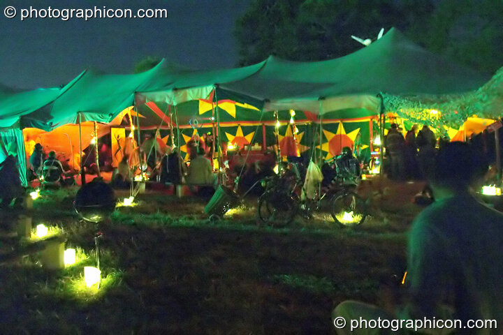 Outside the Small World Stage by candle light at Glastonbury Festival 2004. Pilton, United Kingdom. © 2004 Photographicon