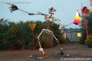 Large robotic sculpture throwing an illuminated traffic cone at Glastonbury Festival 2004. Pilton, United Kingdom. © 2004 Photographicon