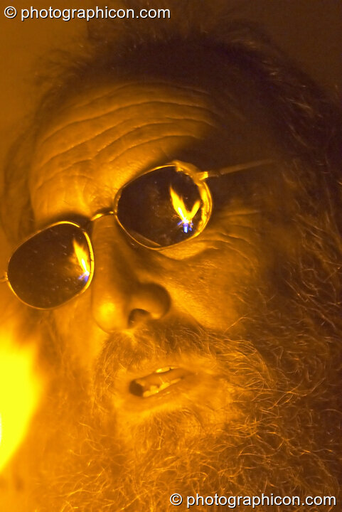 The wizard, Ed Iglehart, making hand-blown glassware at Glastonbury Festival 2004. Pilton, United Kingdom. © 2004 Photographicon