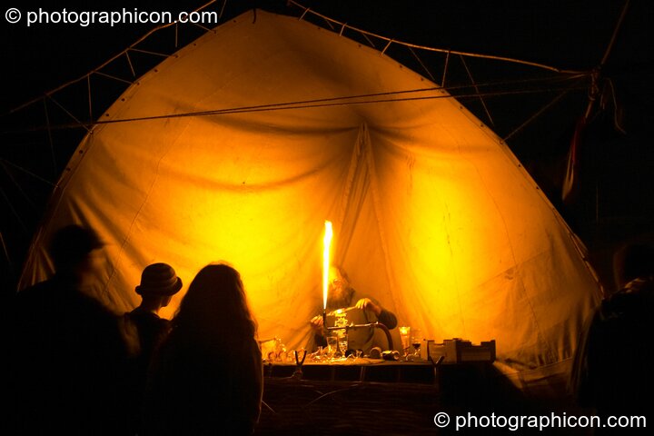 The wizard, Ed Iglehart, making hand-blown glassware at Glastonbury Festival 2004. Pilton, United Kingdom. © 2004 Photographicon
