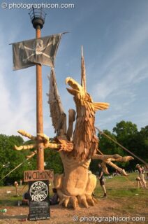 The Tree Pirates Griffon chainsaw sculpture in the King's Meadow at Glastonbury Festival 2005. Pilton, United Kingdom. © 2005 Photographicon