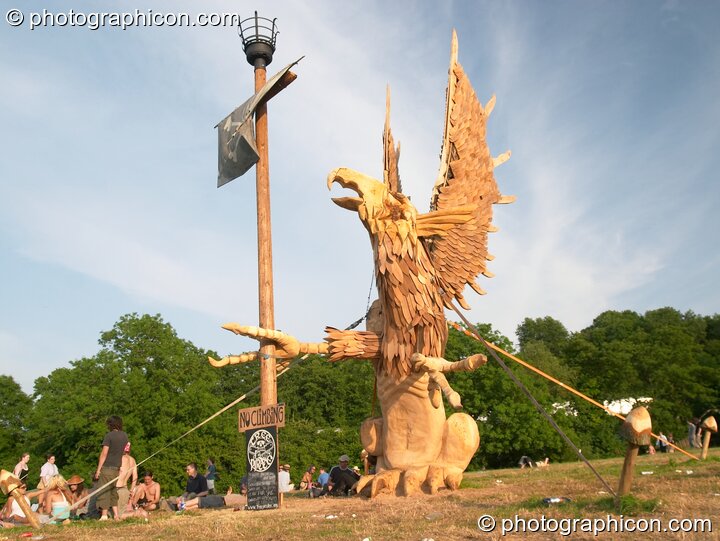 The Tree Pirates Griffon chainsaw sculpture in the King's Meadow at Glastonbury Festival 2005. Pilton, United Kingdom. © 2005 Photographicon