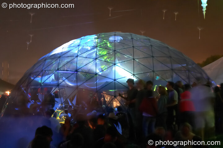 The exterior of the transparent idSpiral dome (Dance Village) by night at Glastonbury Festival 2005. Pilton, United Kingdom. © 2005 Photographicon
