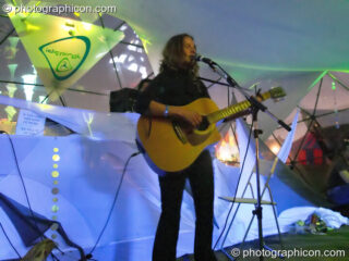 Woman performer in the idSpiral dome (Dance Village) at Glastonbury Festival 2005. Pilton, United Kingdom. © 2005 Photographicon
