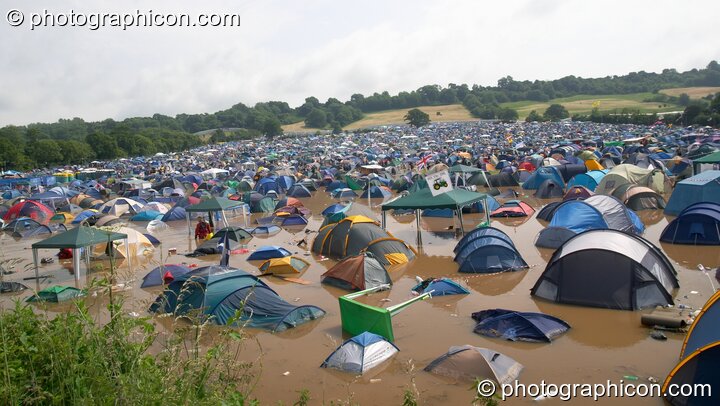 Partially submerged tents after the Pennard Hill camp site flooded at Glastonbury Festival 2005. Pilton, United Kingdom. © 2005 Photographicon
