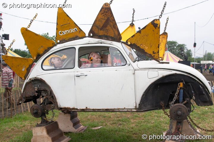 Mutoid Waste Company sculpture of a family of crash-test dummies in a VW Beetle at Glastonbury Festival 2005. Pilton, United Kingdom. © 2005 Photographicon