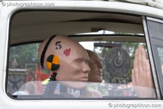 Mutoid Waste Company sculpture of a family of crash-test dummies in a VW Beetle at Glastonbury Festival 2005. Pilton, United Kingdom. © 2005 Photographicon