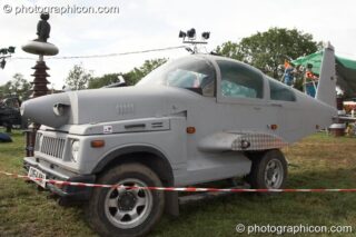 Mutoid Waste Company sculpture of an aircraft/car hybrid in Trash City at Glastonbury Festival 2007. Pilton, United Kingdom. © 2007 Photographicon