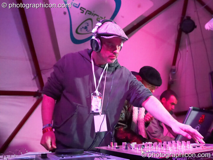 Jon More, Matt Black, and Mathieu Hourteillan of Coldcut perform an AV set on the ID Spiral stage in the Dance Village at Glastonbury Festival 2007. Pilton, United Kingdom. © 2007 Photographicon