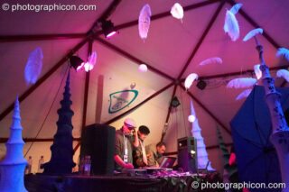 Jon More, Matt Black, and Mathieu Hourteillan of Coldcut perform an AV set on the ID Spiral stage in the Dance Village at Glastonbury Festival 2007. Pilton, United Kingdom. © 2007 Photographicon