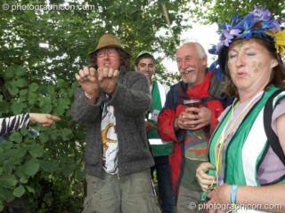 The Green Police on duty arrest a man for urinating in a hedge at Glastonbury Festival 2007. Pilton, United Kingdom. © 2007 Photographicon