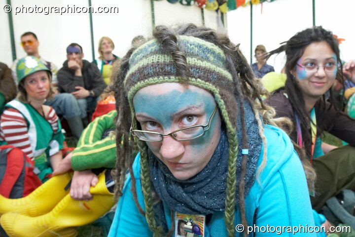 Portrait of a Green Police officer as they prepare their costume, with face painting by Simone Kay & her team, at Glastonbury Festival 2008. Pilton, United Kingdom. © 2008 Photographicon