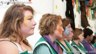 Portrait of a Green Police officer as they prepare their costume, with face painting by Simone Kay & her team, at Glastonbury Festival 2008. Pilton, United Kingdom. © 2008 Photographicon