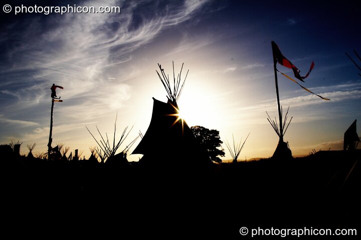 The Tipi Village Silhouetted against the setting sun at Glastonbury Festival 2008. Pilton, United Kingdom. © 2008 Photographicon