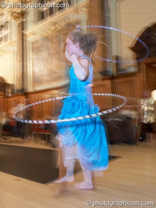 A woman spins a hoop at the London Festival of Tantra 2008. London, United Kingdom. © 2008 Photographicon