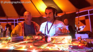 Paul looks on while Super Mario (FluffSquad/Planet Bob, Italy) DJs in the Progressive Tent at Planet Bob's Offworld Festival 2007. Swindon, United Kingdom. © 2007 Photographicon