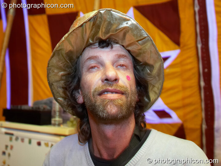 A spaced man wears a golden hat in the Progressive Tent at Planet Bob's Offworld Festival 2007. Swindon, United Kingdom. © 2007 Photographicon
