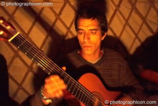 Musicians from Brecha jam in a candle -lit yurt at the Secret Garden Party 2006. Huntingdon, United Kingdom. © 2006 Photographicon