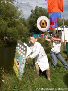 A campaigning group dressed in a giant eye draw attention to the politics of HIV medicine at the Secret Garden Party 2006. Huntingdon, United Kingdom. © 2006 Photographicon