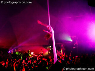 Claire O'Neill performs aerial silk acrobatics in the Remix Tent at the Secret Garden Party 2010. Huntingdon, United Kingdom. © 2010 Photographicon