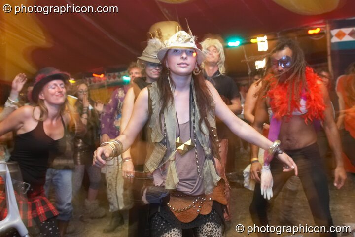People in wonky costume dance in the Lizard tent at the Secret Garden Party 2010. Huntingdon, United Kingdom. © 2010 Photographicon