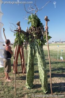 Stilt walkers dressed as earth spirits at Sunrise Celebration 2006. Yeovil, United Kingdom. © 2006 Photographicon