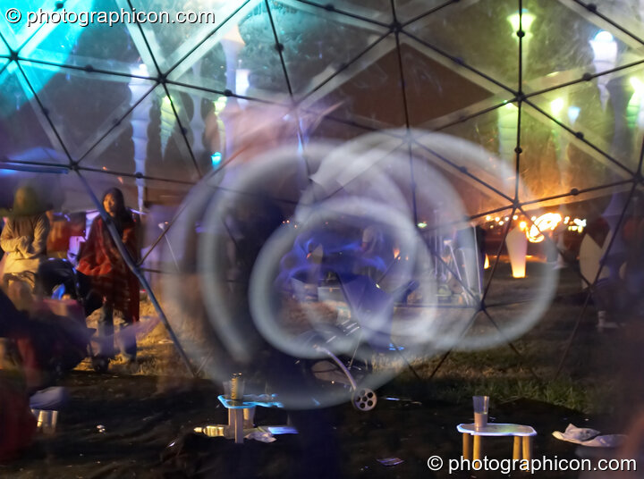 Alex Lee works his glow poi in the idSpiral dome at Sunrise Celebration 2006. Yeovil, United Kingdom. © 2006 Photographicon