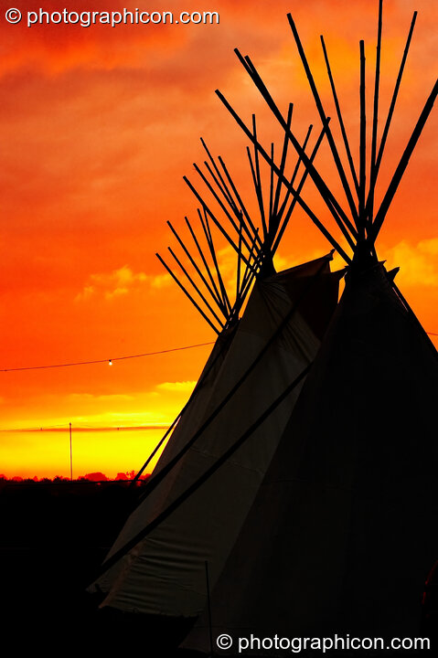 The sun rises behind a tipi at Sunrise Celebration 2007. Yeovil, United Kingdom. © 2007 Photographicon