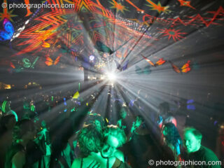 Bright light shines through Tribe of Frogs decor illuminating dancers in the Waveform Dance Tent at Sunrise Celebration 2007. Yeovil, United Kingdom. © 2007 Photographicon