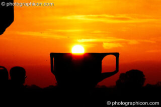 The sun rises over a giant chalice at Sunrise Celebration 2007. Yeovil, United Kingdom. © 2007 Photographicon