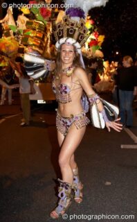 Woman in colourful costume participates in the carnival at the Thames Festival 2005. London, United Kingdom. © 2005 Photographicon
