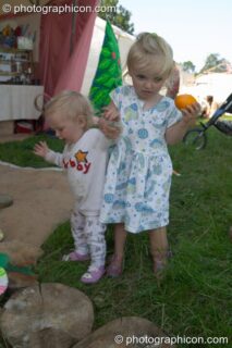 Little girl leads her younger brother on an adventure at the Turaya Gathering 2004. Wimborne, United Kingdom. © 2004 Photographicon